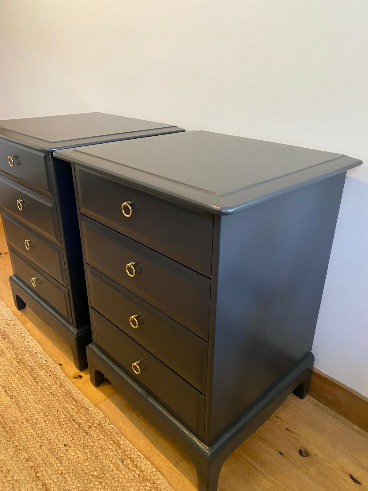 Stag four drawer black bedside cabinets, pair,
