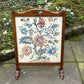 A RUPERT / NIGEL GRIFFITHS MONASTIC CARVED OAK FIRE SCREEN / STAND