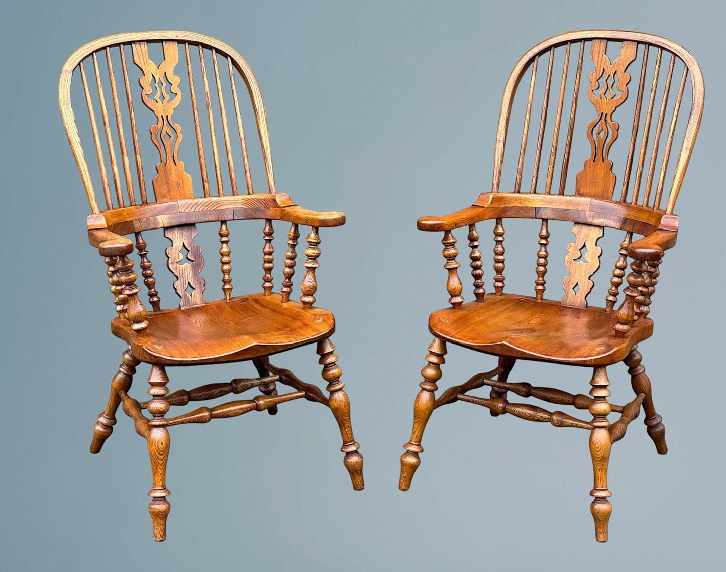 A Large Pair of Ash Broad Arm Windsor Chairs