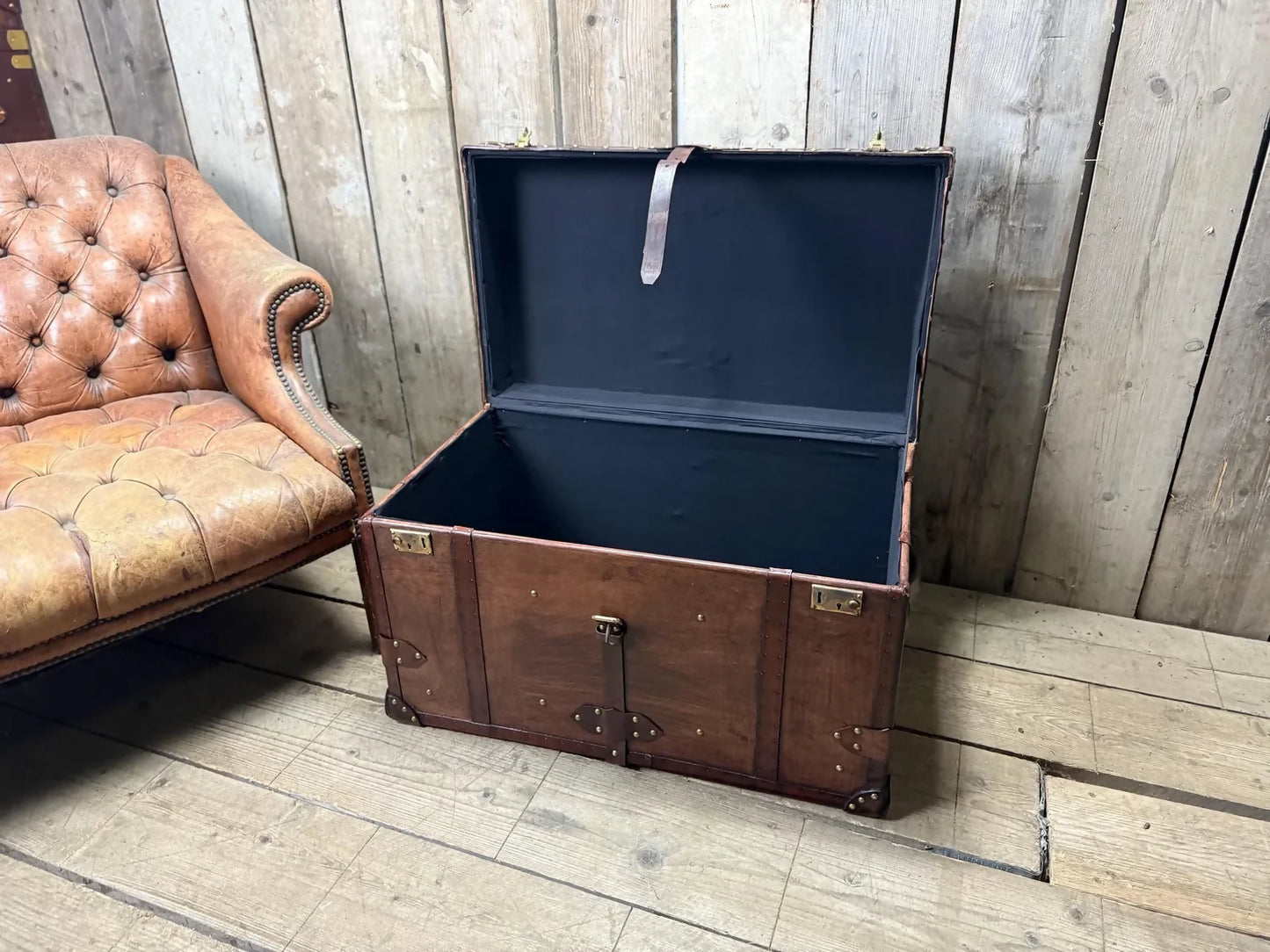 Antique leather trimmed chestnut brown campaign chest
