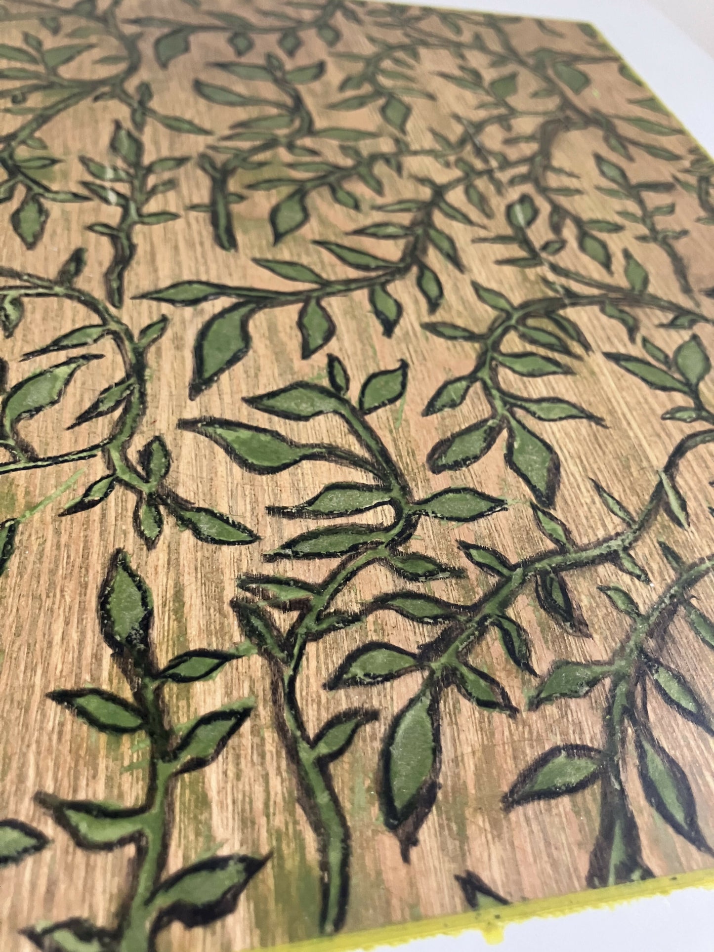 Light grey side table with hand-carved sage motif