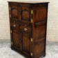 A TITCHMARSH AND GOODWIN SOLID STRESSED OAK WINE CUPBOARD / DRINKS CABINET.