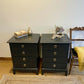 Stag four drawer black bedside cabinets, pair,