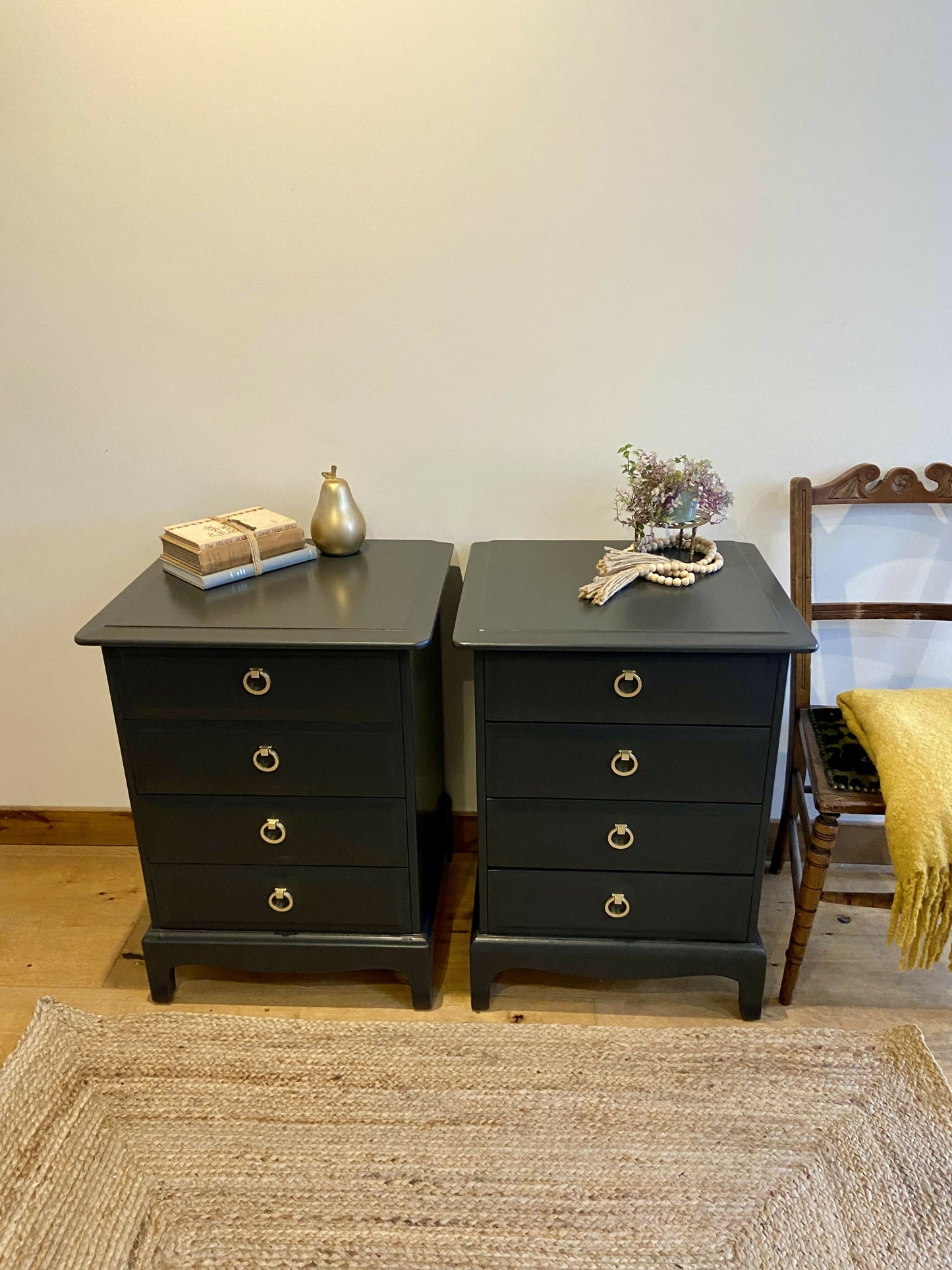 Stag four drawer black bedside cabinets, pair,