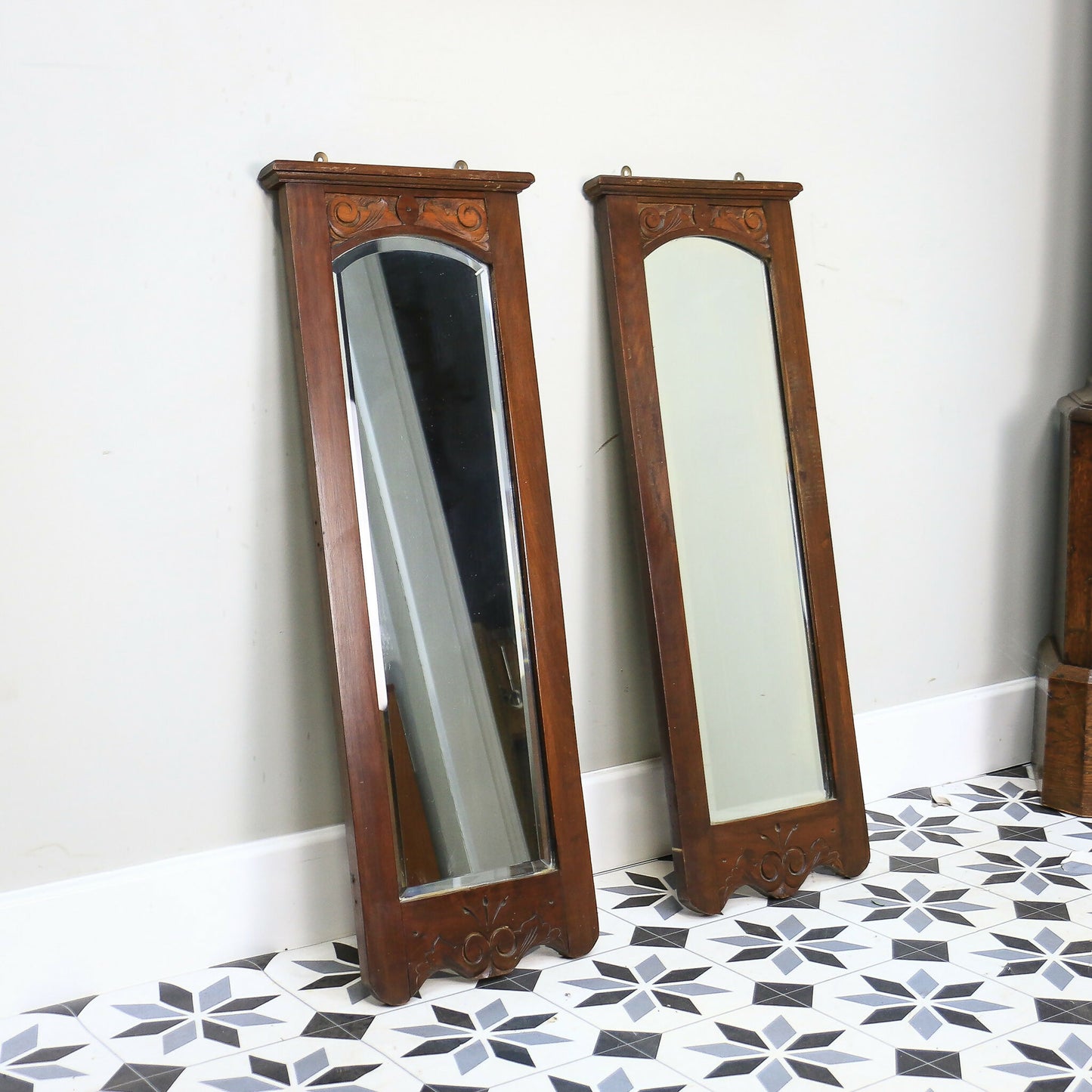 A Pair of Victorian Wall Mirrors Bevel Edged Glass Carved Top and Bottom
