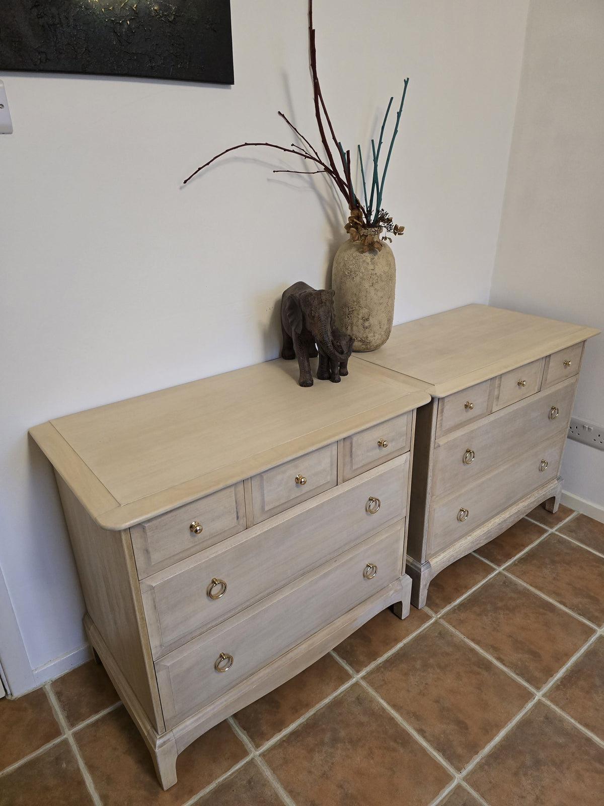 Pair Stag minstrel chest of drawers