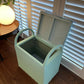 small green wave ottoman open