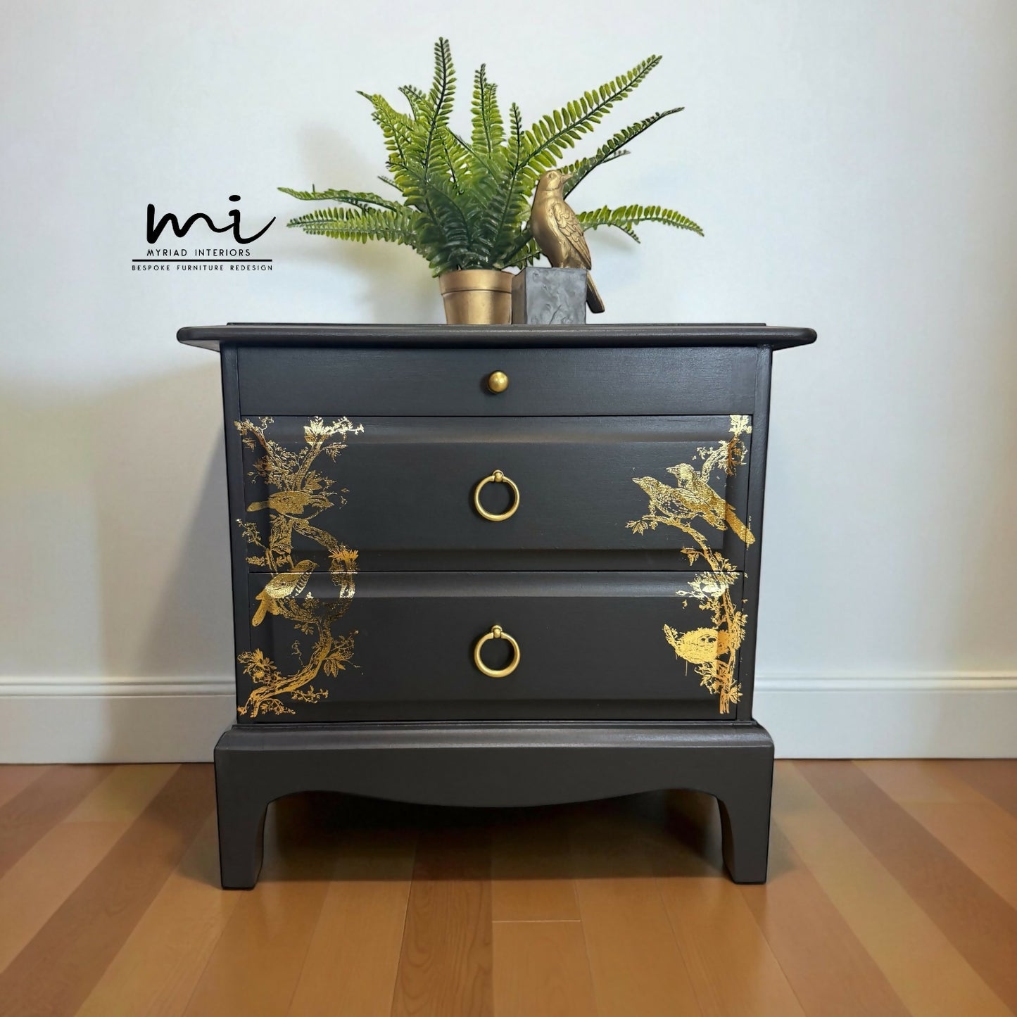 Matt Black Stag Minstrel bedside tables with gold floral and bird design. vintage nightstands. Teatray