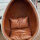Aviation Swivel Egg Chair With Tan Leather.