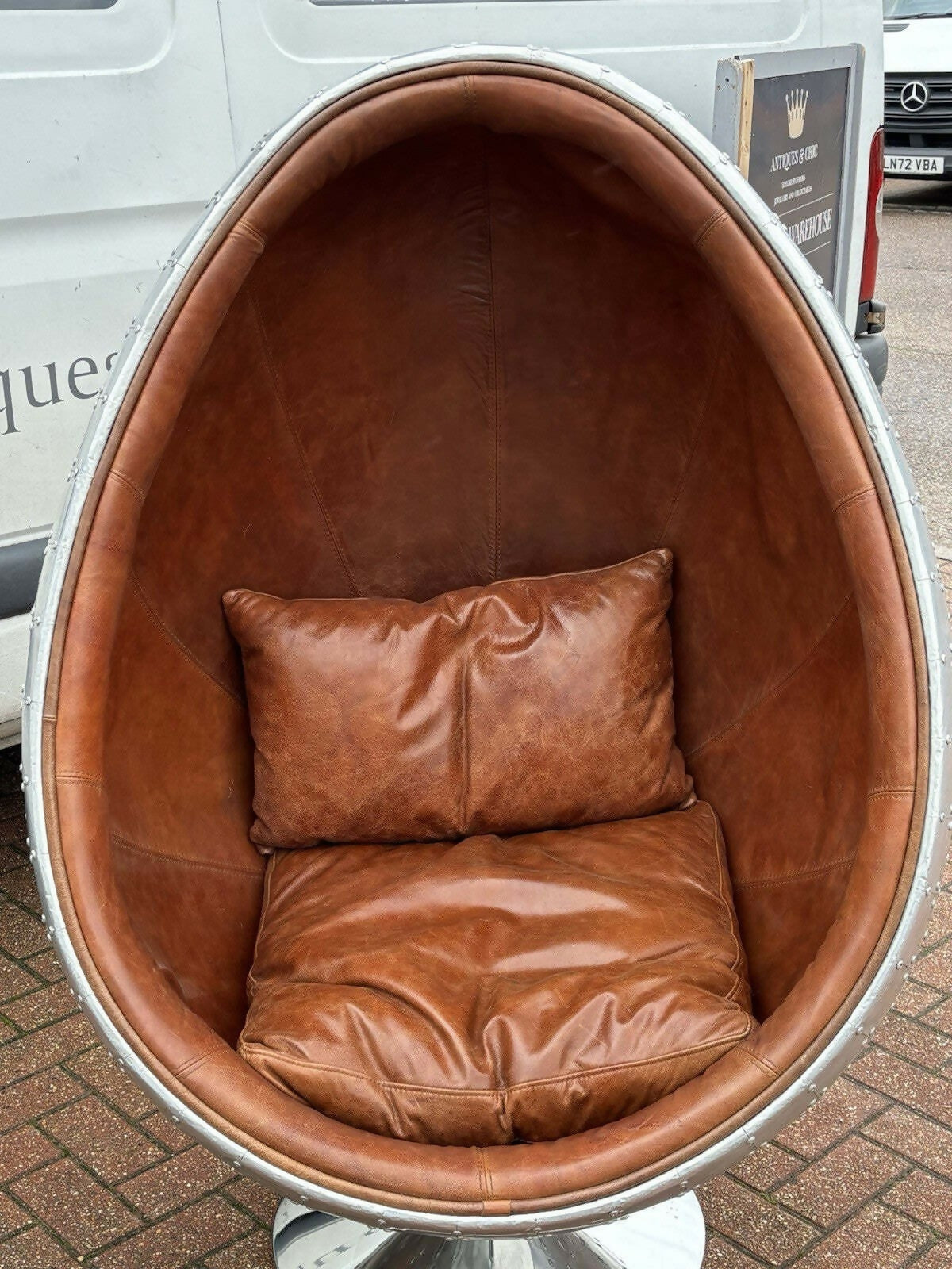 Aviation Swivel Egg Chair With Tan Leather.