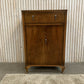 Vintage Art Deco burr walnut veneer cupboard featuring two doors and one drawer.