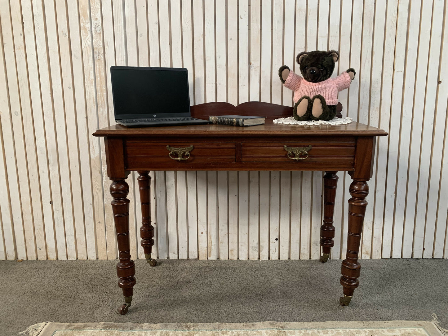 A Victorian Mahogany Writing Table/Desk With Drawer on castors.