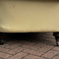 Vintage Victorian Buttoned Back Chesterfield Sofa In Leather On Brass Castors.