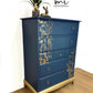 Refinished Stag Minstrel Tallboy Chest Of Drawers In Navy Blue With Gold Foil Floral Bird Design