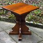 A RUPERT GRIFFITHS MONASTIC CARVED SOLID OAK LAMP TABLE / PLANT STAND