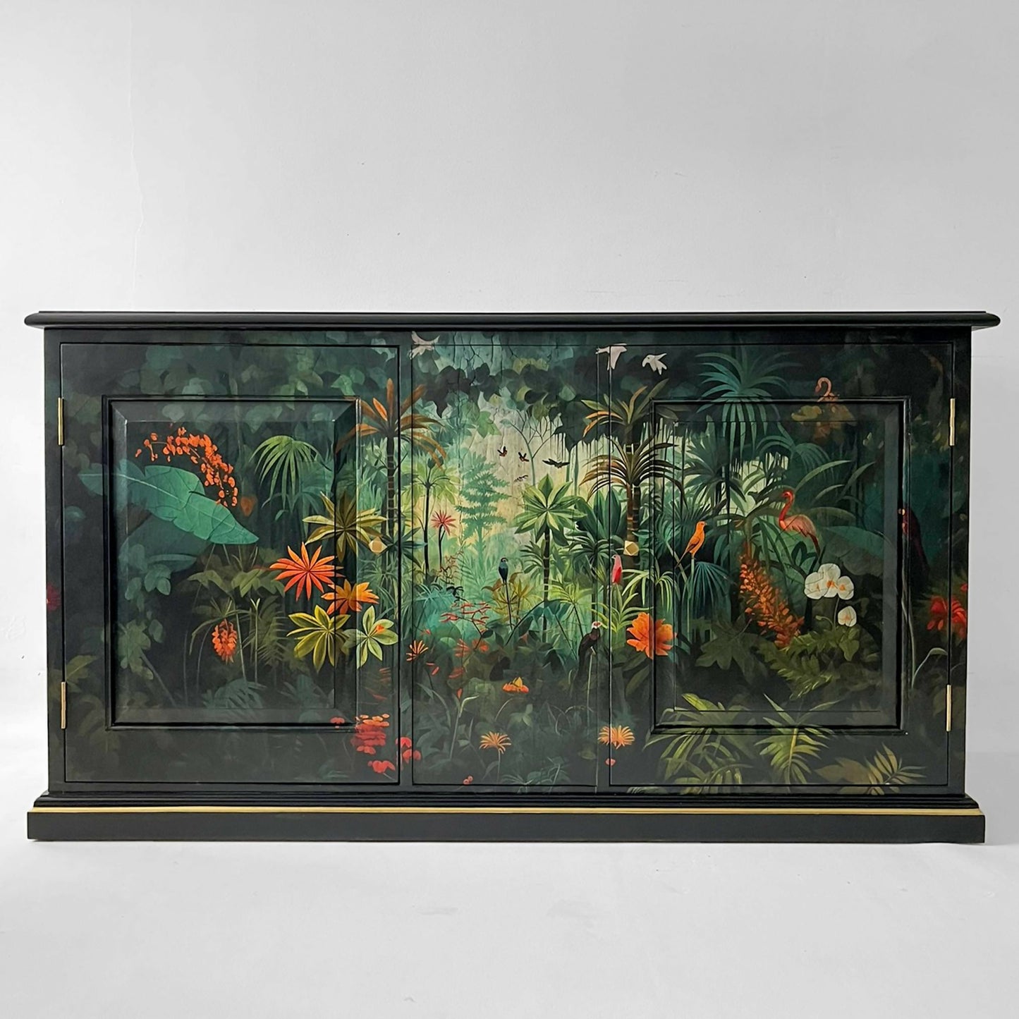 Vintage cabinet TV painted black and decorated with exotic rainforest jungle design in front and sides front