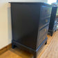Stag four drawer black bedside cabinets, pair,