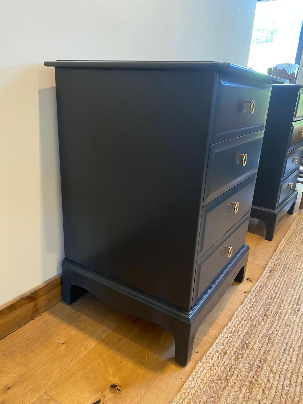 Stag four drawer black bedside cabinets, pair,