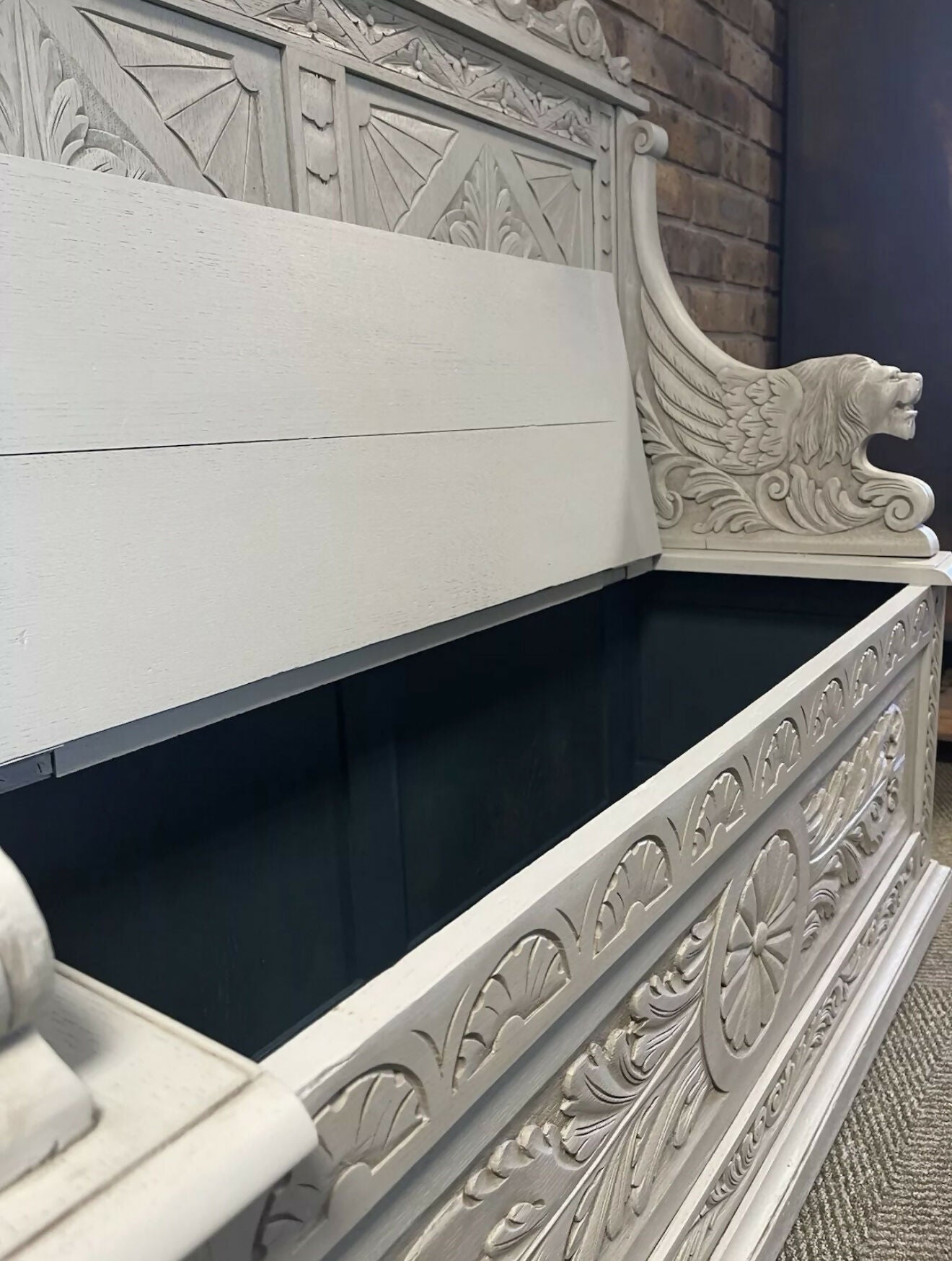 Edwardian antique Settle in solid oak with ornate carvings.