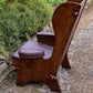 A NIGEL RUPERT GRIFFITHS MONASTIC CARVED OAK LEATHER FIRESIDE CHAIR / ARMCHAIR