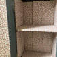 Dark grey wooden storage cabinet with hand carved flowers and linen interior
