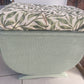 Small mid century Ottoman storage and seat. Sage green paint makes you choose the material.