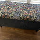 Black satin painted Lloyd loom ottoman. You choose the fabric