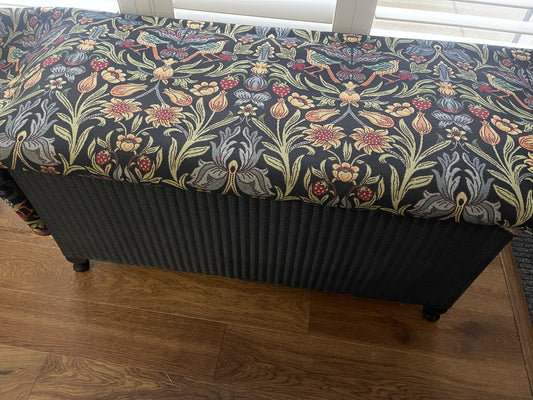 Black satin painted Lloyd loom ottoman. You choose the fabric