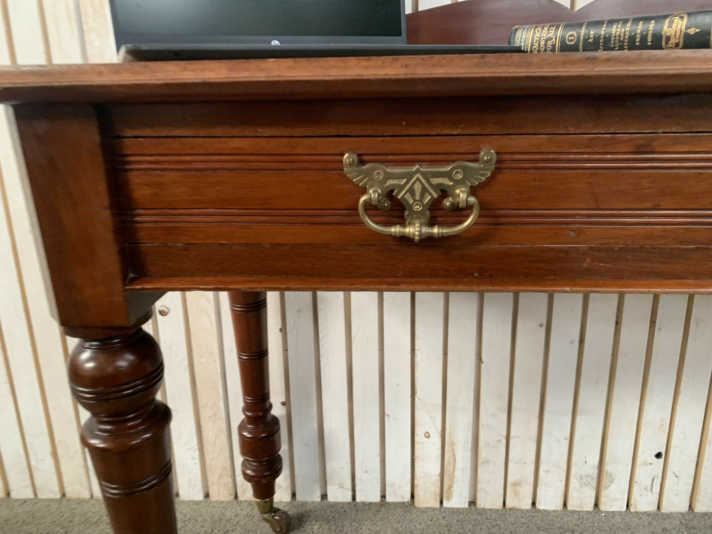 A Victorian Mahogany Writing Table/Desk With Drawer on castors.