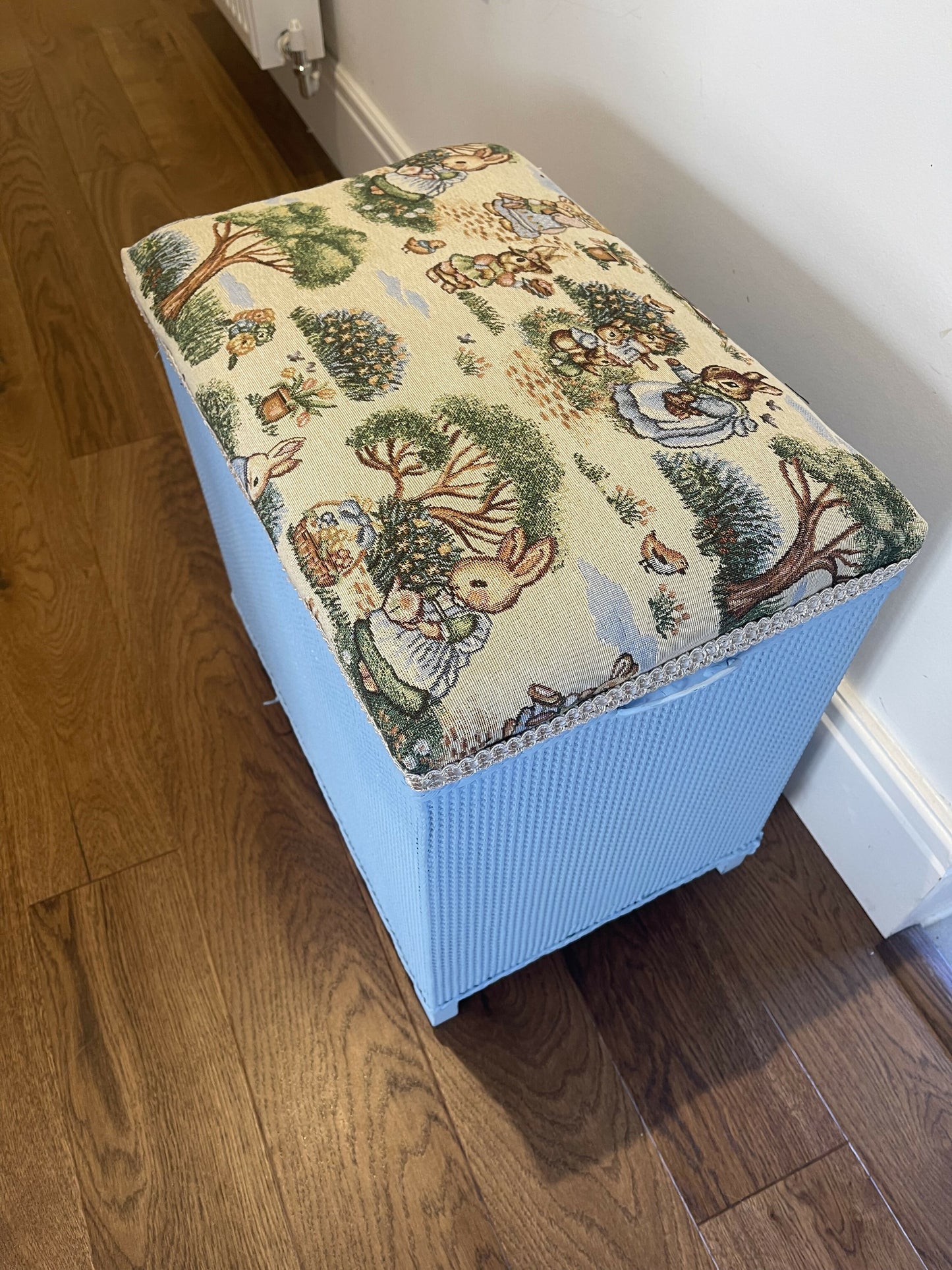 Bijou ottoman seat sky blue with Peter Rabbit themed upholstery. 45cm high 45cm long 30cm deep