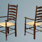 A Pair of Oak Ladder Back Rush Seated Armchairs