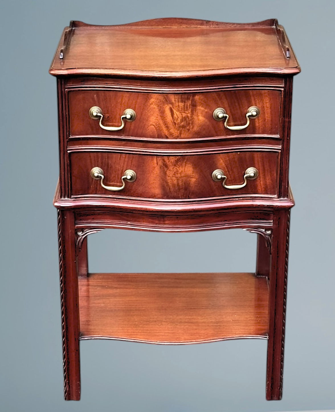 A Figured Mahogany Serpentine Chest of Drawers / Bedside Chest