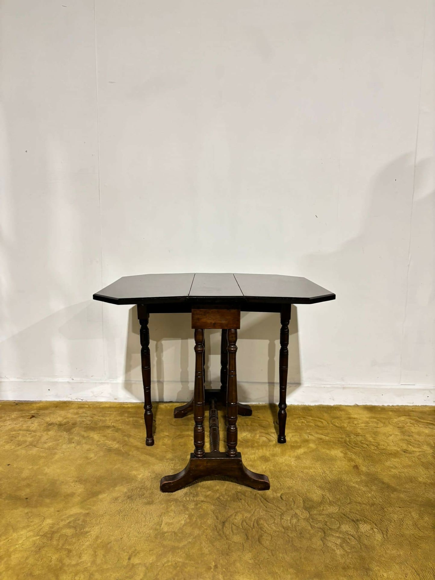 Edwardian mahogany table of small proportions resting on turned legs.8