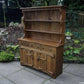 A RUPERT / NIGEL GRIFFITHS MONASTIC CARVED OAK DERBYSHIRE DRESSER / SIDEBOARD.
