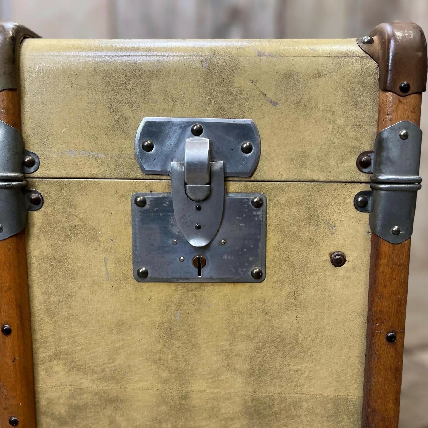 antique beige leather banded travel trunk with keys