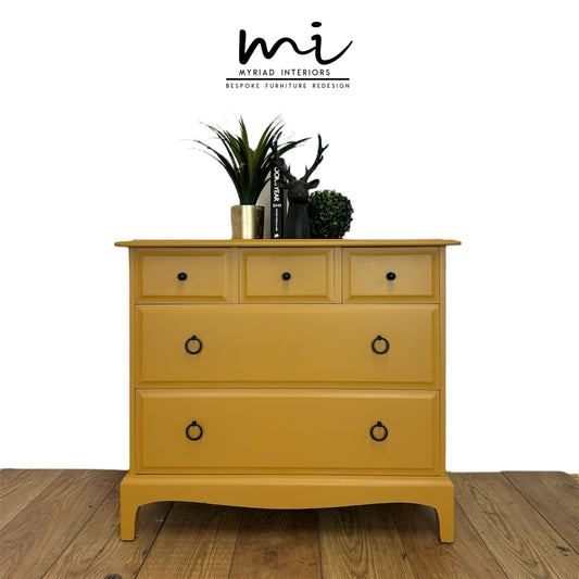 Stag Minstrel Chest Of Drawers in mustard yellow, oversized bedside table, dresser, mid century, 5 drawer, maximalist, bold black, sideboard