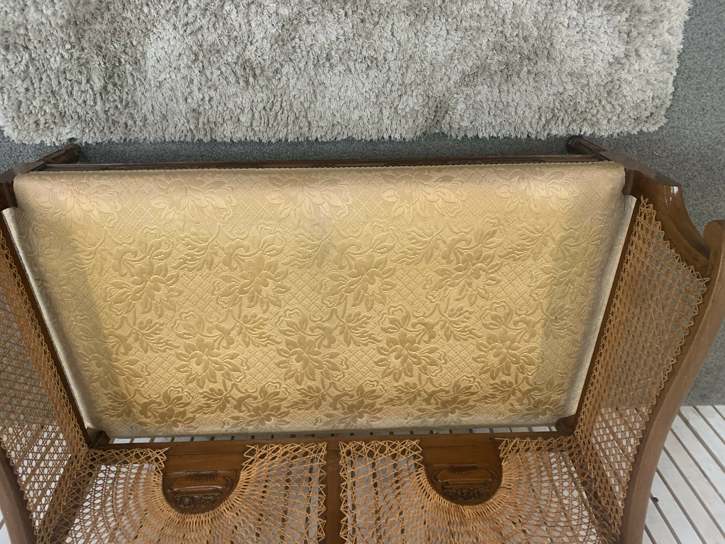 Very attractive and unique antique gold-colored cane bergère two-seater sofa.