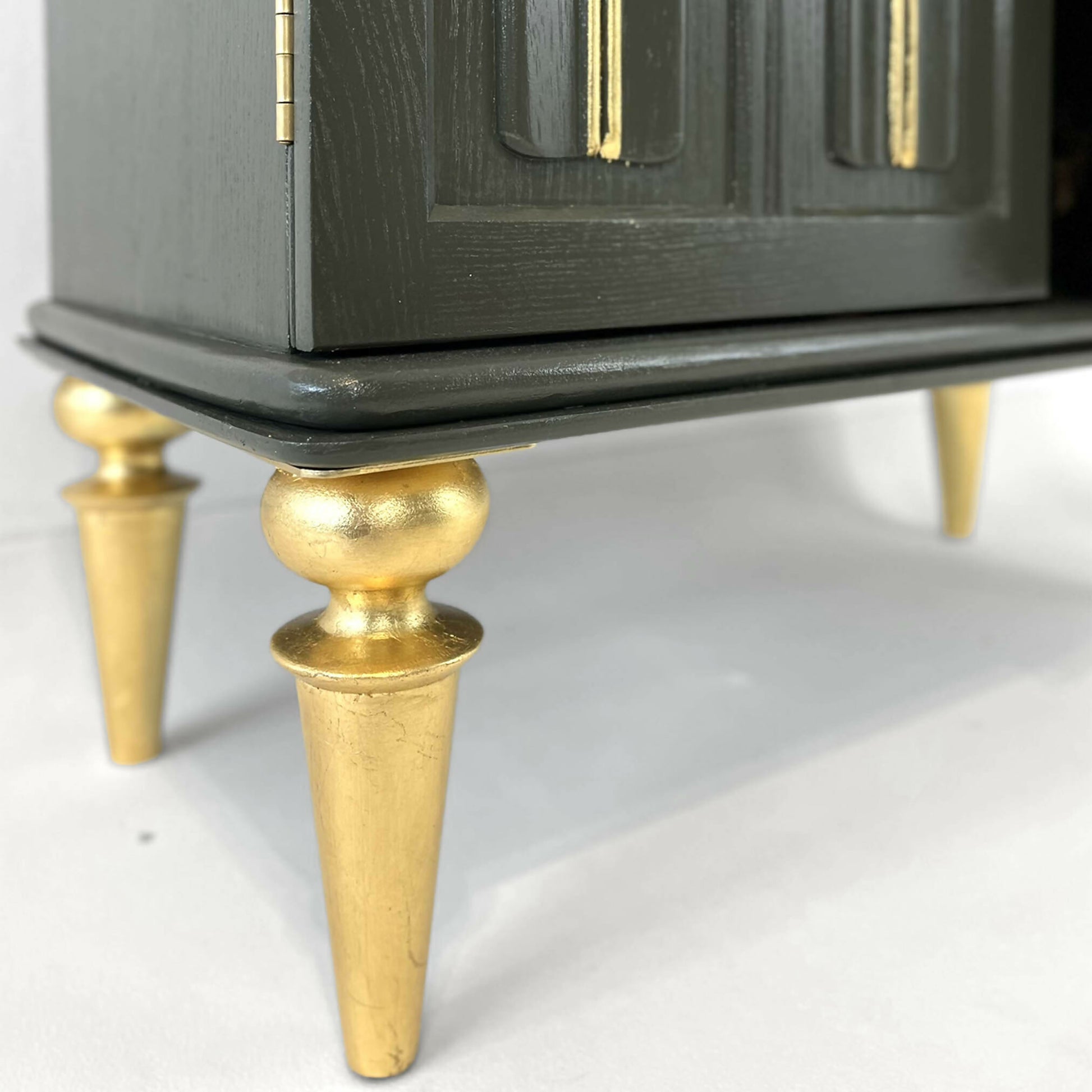 Painted green antique drinks cabinet with gold guilded legs