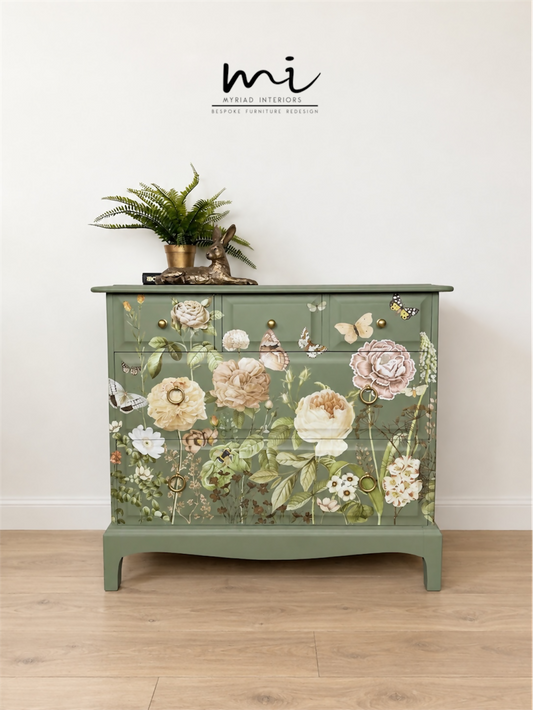 Sage green Stag Minstrel chest of drawers with neutral floral design. 3 over 2. Sideboard, dresser, bedside table