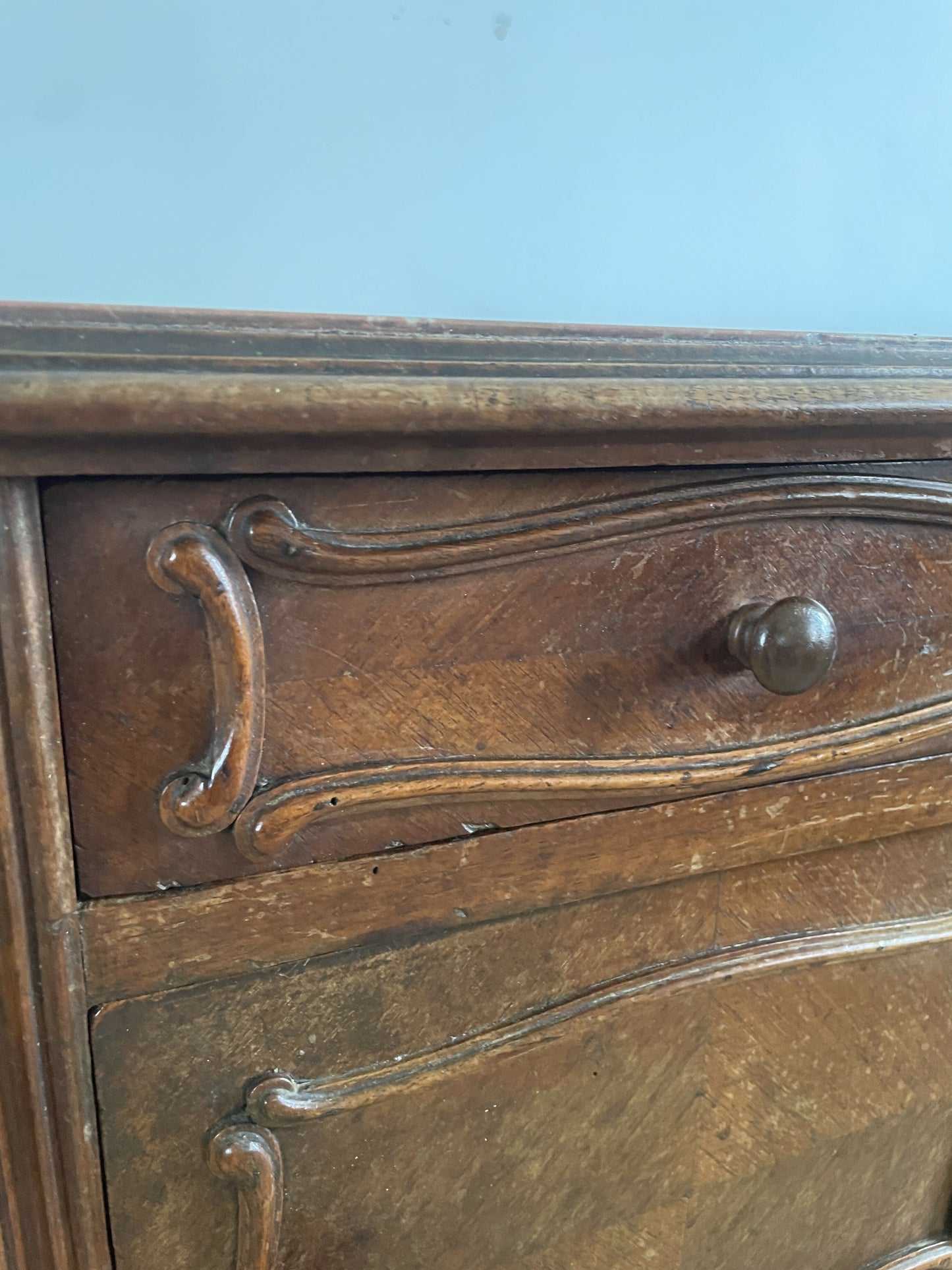 A near pair of antique French walnut and marble bedside tables