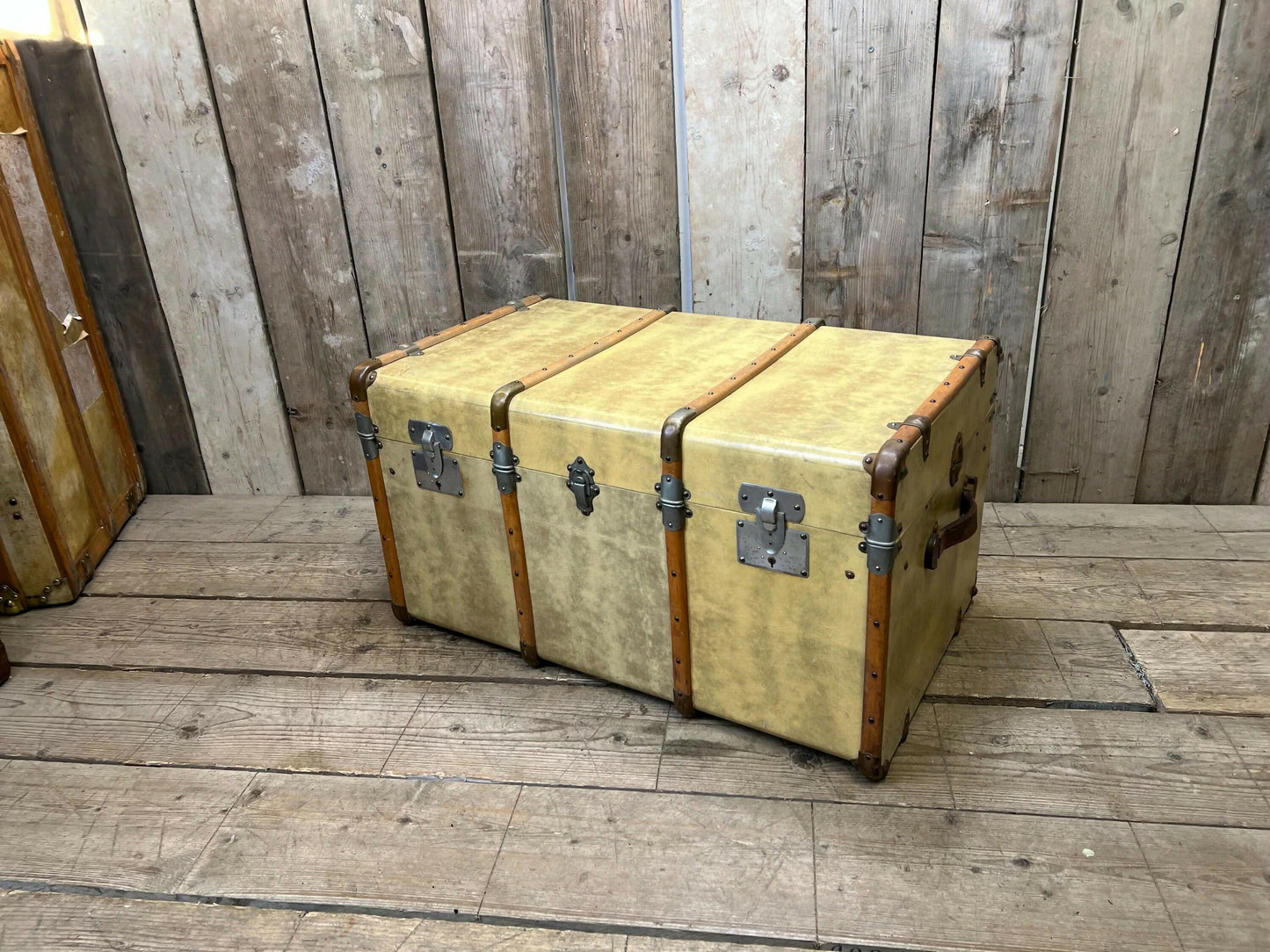 antique beige leather banded travel trunk with keys