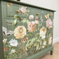 Sage green Stag Minstrel chest of drawers with neutral floral design. 3 over 2. Sideboard, dresser, bedside table