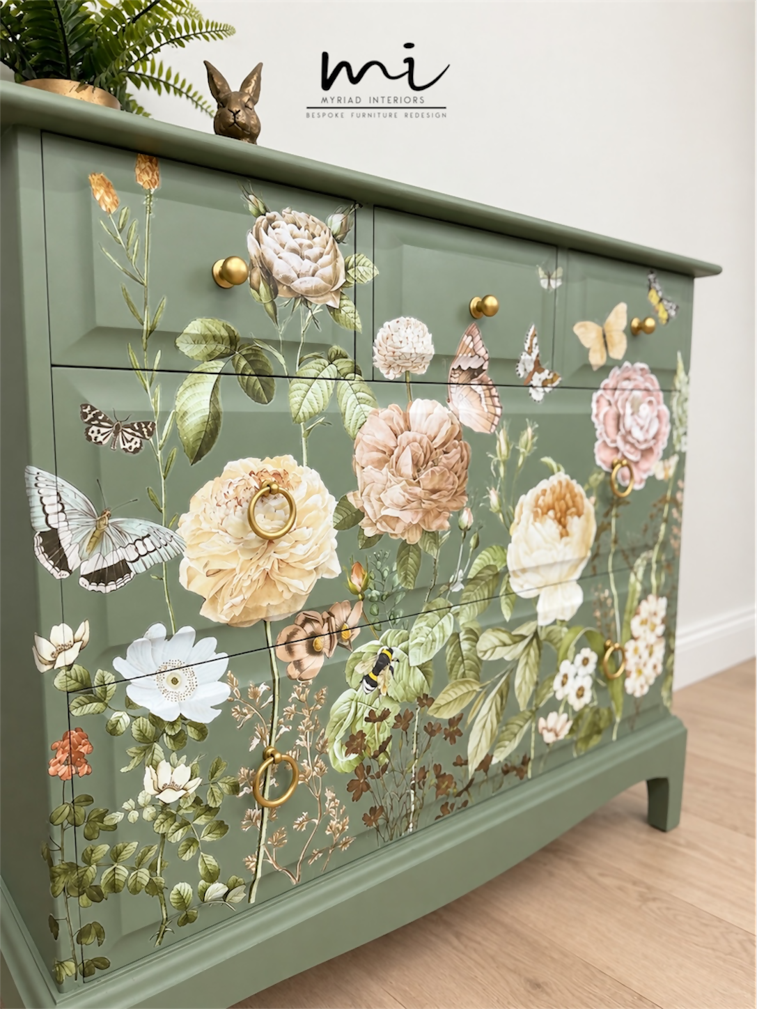 Sage green Stag Minstrel chest of drawers with neutral floral design. 3 over 2. Sideboard, dresser, bedside table