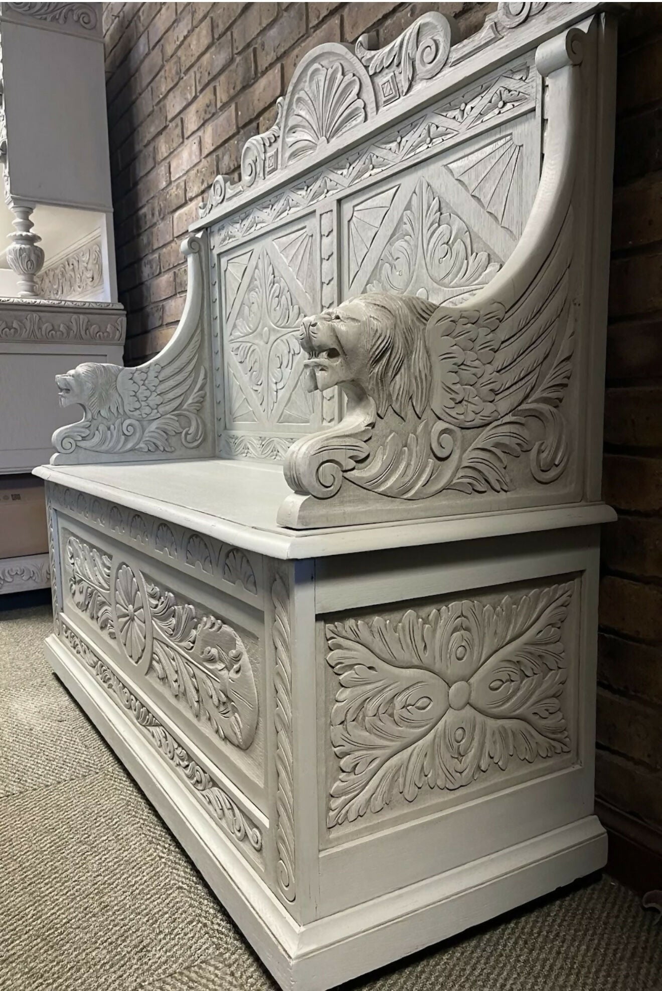 Edwardian antique Settle in solid oak with ornate carvings.