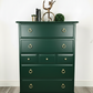 Stag minstrel tallboy chest of drawers in dark green