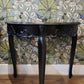 Reproduction Maison Demi Lune Console in black, manufactured by Gallery Direct Ltd