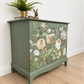 Sage green Stag Minstrel chest of drawers with neutral floral design. 3 over 2. Sideboard, dresser, bedside table