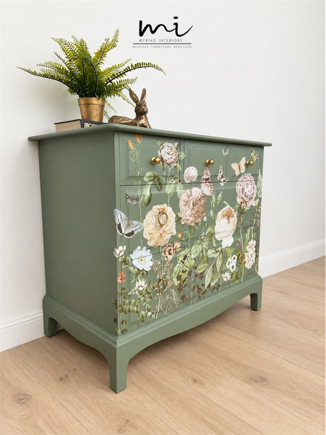 Sage green Stag Minstrel chest of drawers with neutral floral design. 3 over 2. Sideboard, dresser, bedside table