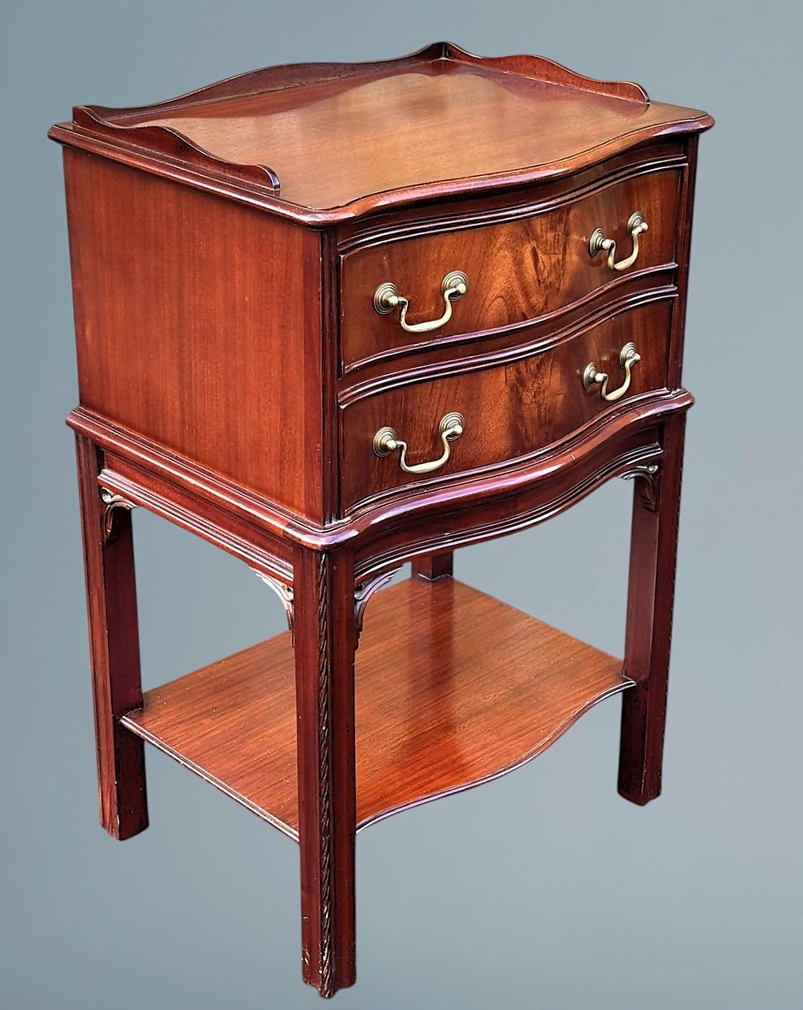 A Figured Mahogany Serpentine Chest of Drawers / Bedside Chest