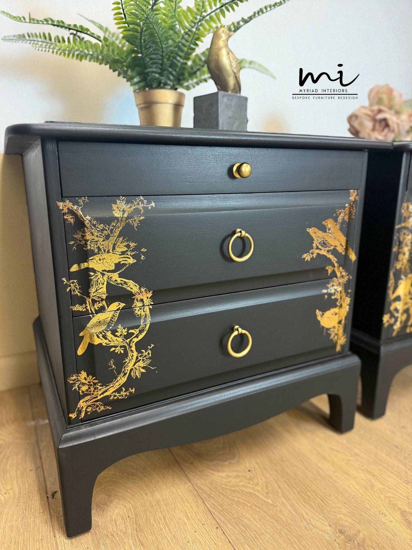 Matt Black Stag Minstrel bedside tables with gold floral and bird design. vintage nightstands. Teatray
